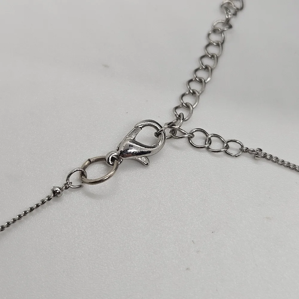 silver tone chain necklace with gray banded bead